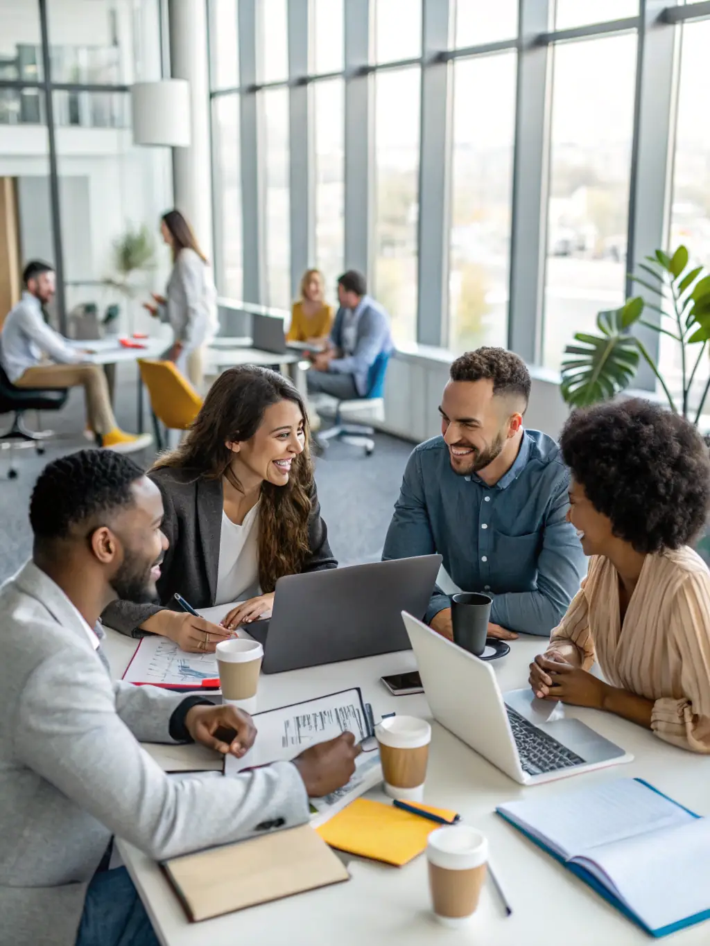 A diverse group of South African entrepreneurs collaborating in a co-working space, brainstorming ideas and discussing business strategies, representing entrepreneurship development.